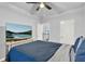 Bright bedroom with a large bed, modern flooring, and television at 17052 Cercis Loop, Clermont, FL 34711