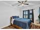 Bedroom featuring a large bed, modern flooring, and bright natural light at 17052 Cercis Loop, Clermont, FL 34711