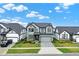 Well maintained two-story home with gray siding, stone accents, landscaped front yard and modern design at 17052 Cercis Loop, Clermont, FL 34711