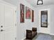 Inviting foyer with a decorative rug, stylish bench, and artful accents creating a warm welcome at 17052 Cercis Loop, Clermont, FL 34711
