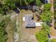 An aerial view of a lovely home with a driveway and some yard space at 1870 Blackwelder Rd, De Leon Springs, FL 32130