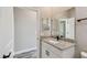 Bathroom with a granite vanity, and a door to the shower room at 1870 Blackwelder Rd, De Leon Springs, FL 32130