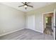 Bedroom featuring neutral walls, carpet floors, a ceiling fan, and closet at 1870 Blackwelder Rd, De Leon Springs, FL 32130
