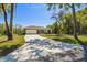 Beautiful single-story home featuring a two-car garage, stone accents, and a large driveway at 1870 Blackwelder Rd, De Leon Springs, FL 32130