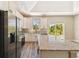 Modern kitchen featuring white cabinets, stainless steel appliances, granite countertops, and a center island at 1870 Blackwelder Rd, De Leon Springs, FL 32130