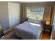 Bright bedroom featuring a large window, closet space, and neutral decor at 217 Wilmer Ave, Orlando, FL 32811