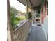 Inviting covered front porch with classic columns, offering a relaxing outdoor space and neighborhood views at 217 Wilmer Ave, Orlando, FL 32811