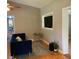 Cozy living room featuring a plush blue sofa, decorative rug, and recessed television at 217 Wilmer Ave, Orlando, FL 32811