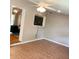 Living room has a ceiling fan, tiled floors, and an open layout for easy movement at 217 Wilmer Ave, Orlando, FL 32811