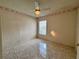 Neutral bedroom with tile floors, a ceiling fan with light fixture, window and decorative wallpaper border at 235 Tuscany Pointe Ave, Orlando, FL 32807