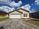 Charming single-story home featuring a tile roof and an attached two-car garage at 235 Tuscany Pointe Ave, Orlando, FL 32807