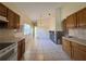 Kitchen space that features an oven, lots of tile flooring, lots of natural light, and dark wood cabinets at 235 Tuscany Pointe Ave, Orlando, FL 32807