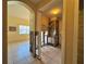 Utility area featuring tile flooring and an exposed utility system visible through the open frame of removed drywall at 235 Tuscany Pointe Ave, Orlando, FL 32807