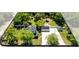 Aerial view highlighting the property's expansive yard, detached garage, and mature trees at 2431 Narcissus Ave, Sanford, FL 32771
