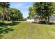 Lush, expansive backyard features mature trees with plenty of room to add a pool or playset at 2431 Narcissus Ave, Sanford, FL 32771