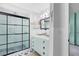 Bathroom featuring a glass shower, vanity with drawers, and decorative tile floor at 2431 Narcissus Ave, Sanford, FL 32771