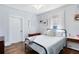Bright bedroom with hardwood floors, white trim, and a comfortable bed at 2431 Narcissus Ave, Sanford, FL 32771