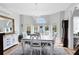 Bright dining room with a chandelier, multiple windows and classic furnishings at 2431 Narcissus Ave, Sanford, FL 32771