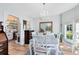 Elegant dining room featuring a chandelier, large mirror, and view to kitchen at 2431 Narcissus Ave, Sanford, FL 32771