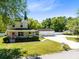 Charming two-story home with a welcoming front porch and a well-manicured lawn at 2431 Narcissus Ave, Sanford, FL 32771