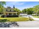 Charming two-story home with a lovely front porch, well-manicured lawn, and detached garage at 2431 Narcissus Ave, Sanford, FL 32771