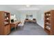 Bright home office featuring a desk, shelving, and comfortable seating at 2431 Narcissus Ave, Sanford, FL 32771