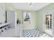 Well-lit laundry room with modern appliances, stylish tile flooring, and exterior access at 2431 Narcissus Ave, Sanford, FL 32771