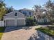 Stately home with a two-car garage and lush landscaping at 254 Sylvan Blvd, Winter Park, FL 32789