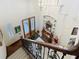 Grand foyer view from the staircase, showcasing the front door and chandelier at 254 Sylvan Blvd, Winter Park, FL 32789