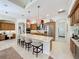 Well-lit kitchen with an island, stainless steel appliances, and custom cabinetry at 254 Sylvan Blvd, Winter Park, FL 32789