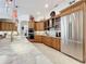 Bright kitchen with a stainless steel refrigerator and modern cooking appliances at 254 Sylvan Blvd, Winter Park, FL 32789