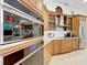 Close up view of the gourmet kitchen with stainless steel appliances and custom cabinetry at 254 Sylvan Blvd, Winter Park, FL 32789
