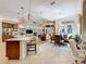 Open-concept living space showcasing the kitchen, dining area, and living room with a fireplace at 254 Sylvan Blvd, Winter Park, FL 32789