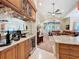 View of the wet bar and living room with fireplace and expansive windows at 254 Sylvan Blvd, Winter Park, FL 32789