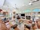 Open-concept living room with fireplace, built-in shelves, and seamless transition to the modern kitchen at 254 Sylvan Blvd, Winter Park, FL 32789