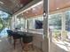 Outdoor bar area with barstool seating, a view of the water, and adjacent patio at 254 Sylvan Blvd, Winter Park, FL 32789