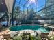 Enclosed pool area with a relaxing spa and comfortable lounge chairs, perfect for enjoying the sun at 254 Sylvan Blvd, Winter Park, FL 32789