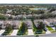 Aerial view of a beautiful home with manicured landscaping, a well maintained lawn and driveway at 2683 Manesty Ln, Kissimmee, FL 34747