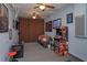 Finished basement with multiple video game stations, arcade games, seating, and decorative wall hangings at 2683 Manesty Ln, Kissimmee, FL 34747