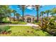 Beautiful clubhouse with manicured landscaping, lush green grass, and inviting entrance for residents to enjoy in the community at 2683 Manesty Ln, Kissimmee, FL 34747