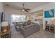 Bright open-concept living space with views of the dining area, kitchen, and outdoor patio at 2683 Manesty Ln, Kissimmee, FL 34747