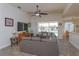 Open-concept living room with large sliding glass doors, tile flooring and lots of space at 2683 Manesty Ln, Kissimmee, FL 34747