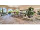 Elegant outdoor lounge area with comfortable seating, lush greenery, and a tranquil atmosphere, perfect for relaxing or socializing at 2683 Manesty Ln, Kissimmee, FL 34747