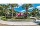 Colorful castle-themed playground surrounded by lush landscaping, providing a fun and safe environment for children to play and explore at 2683 Manesty Ln, Kissimmee, FL 34747