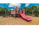 Community playground with a fun pink slide and castle play structure at 2683 Manesty Ln, Kissimmee, FL 34747