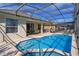 Sparkling pool with spa and screened-in lanai, perfect for outdoor relaxation and enjoyment at 2683 Manesty Ln, Kissimmee, FL 34747