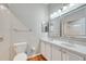 Bathroom featuring double sinks, matching framed mirrors, and tiled flooring at 3084 Stillwater Dr, Kissimmee, FL 34743