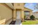 Exterior shot of front door and landscaping at 3084 Stillwater Dr, Kissimmee, FL 34743