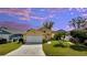 Charming single-story home with a well-manicured lawn, a two-car garage, and a beautifully landscaped front yard at 3084 Stillwater Dr, Kissimmee, FL 34743