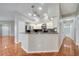 Bright kitchen features stainless steel appliances, a breakfast bar, and white cabinets, perfect for casual dining at 3084 Stillwater Dr, Kissimmee, FL 34743